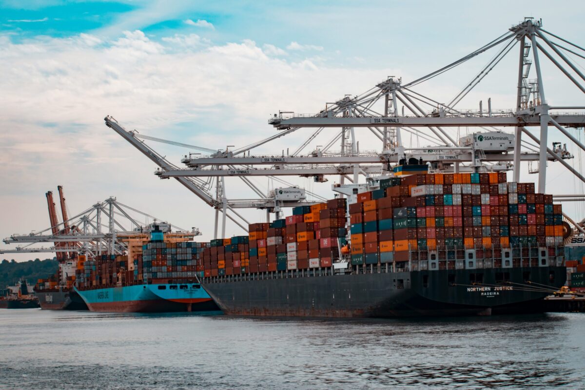 Large cargo container ship at a port, symbolizing the steady growth in U.S. port activity despite challenges in ground logistics.